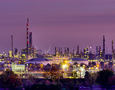 industry skyline in front of a purple sky